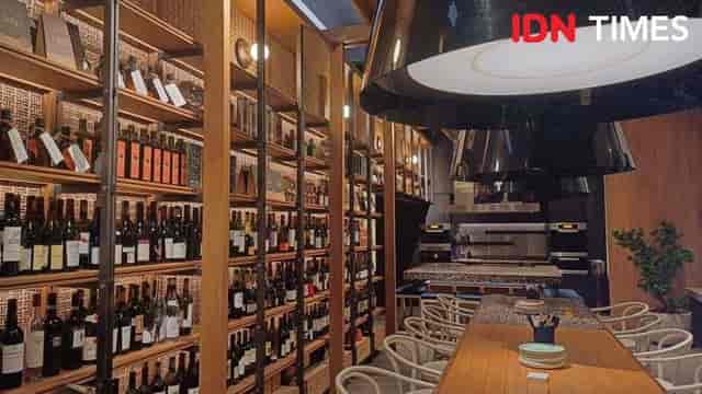Stylish Social House venue with wine display, ideal for upscale events and gatherings.