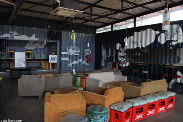 Main Bar Area in 365 Eco Bar, featuring industrial seating for creative events and workshops.