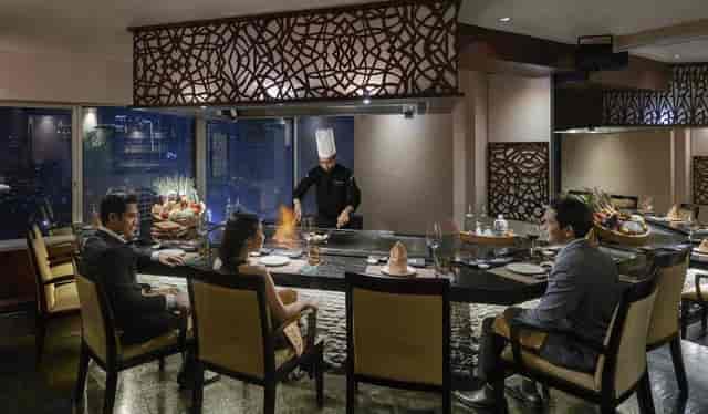 Private dining room with teppanyaki chef for corporate events and networking dinners.