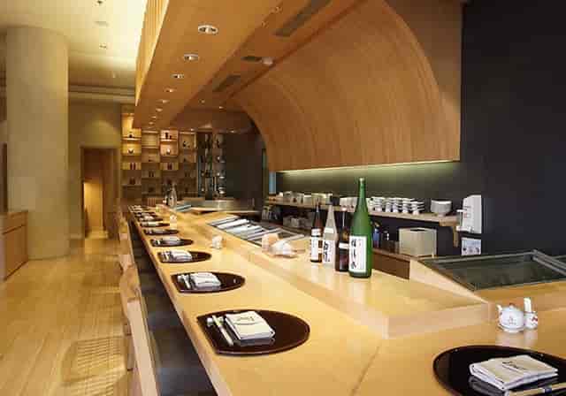 Modern sushi bar in Asuka Japanese Dining, perfect for fine dining and networking events.