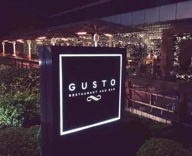 Stylish Gusto Italian restaurant at night, ideal for upscale events and dining.