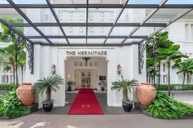 Elegant hotel entrance with red carpet, perfect for luxury events in Jakarta.