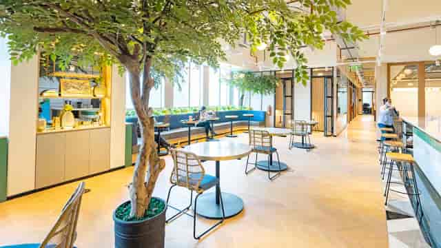 Modern coworking space in GoWork, bright with greenery for productive events.