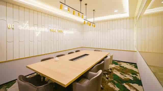 Modern GoWork meeting room with spacious table and ergonomic chairs for collaboration.
