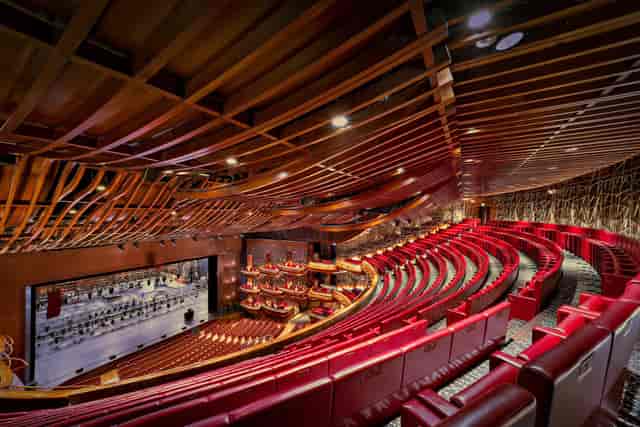 Modern Dubai Opera auditorium with tiered seating, ideal for concerts and conferences.