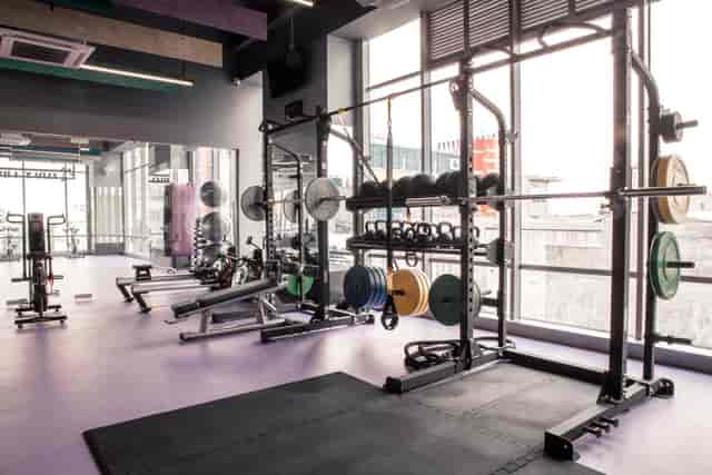 Modern gym at Elite Club with natural light, perfect for fitness events and team-building.