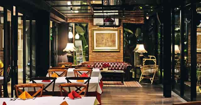 Elegant dining space at Patio Jakarta, ideal for gatherings, with modern decor and warm lighting.