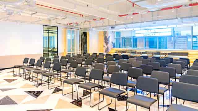 Modern meeting space with black chairs for corporate events and workshops.