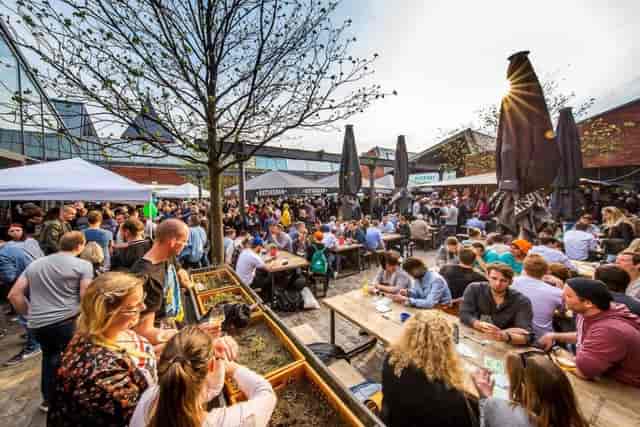 Braugasthaus outdoor event space with tables and tents for casual networking and gatherings.