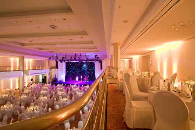 Grand Elysée Hamburg ballroom with elegant tables, perfect for weddings and corporate events.