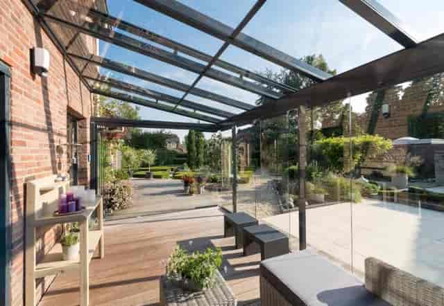 Glass-enclosed terrace at Kulturhof Dulsberg, ideal for events and meetings.