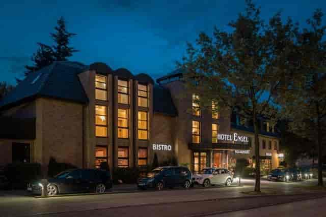 Hotel Engel lounge exterior lit at dusk, perfect for meetings and events.