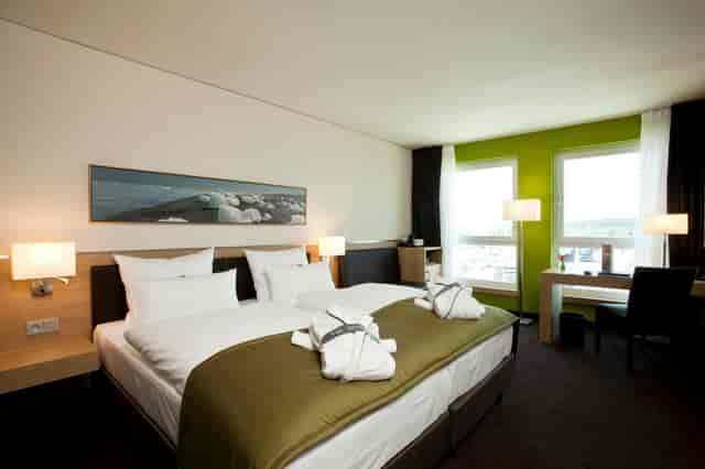 Foyer Level 2 at ATLANTIC Hotel Kiel, modern decor for business travelers and events.