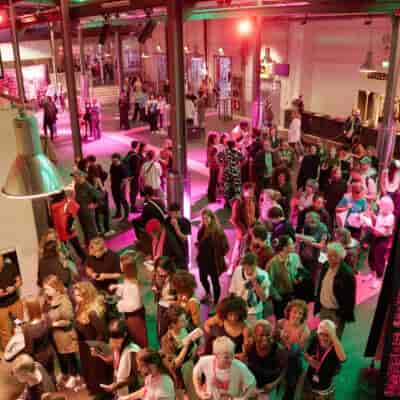 Kampnagel Theater event with diverse crowd and vibrant ambiance for networking opportunities