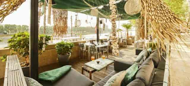 Chic Skybar terrace at Designhotel ÜberFluss, ideal for upscale events and gatherings.