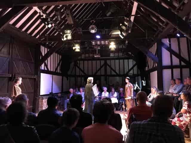 Intimate theater with wooden beams at Riverhouse Barn Arts Centre for engaging performances.