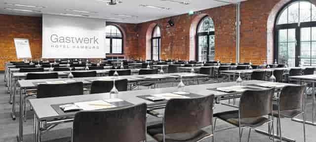 Conference room at Gastwerk Hotel Hamburg with modern furnishings for corporate events.