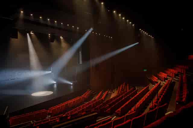 Abbey Theatre Main Stage with dramatic lighting, perfect for performances and events.