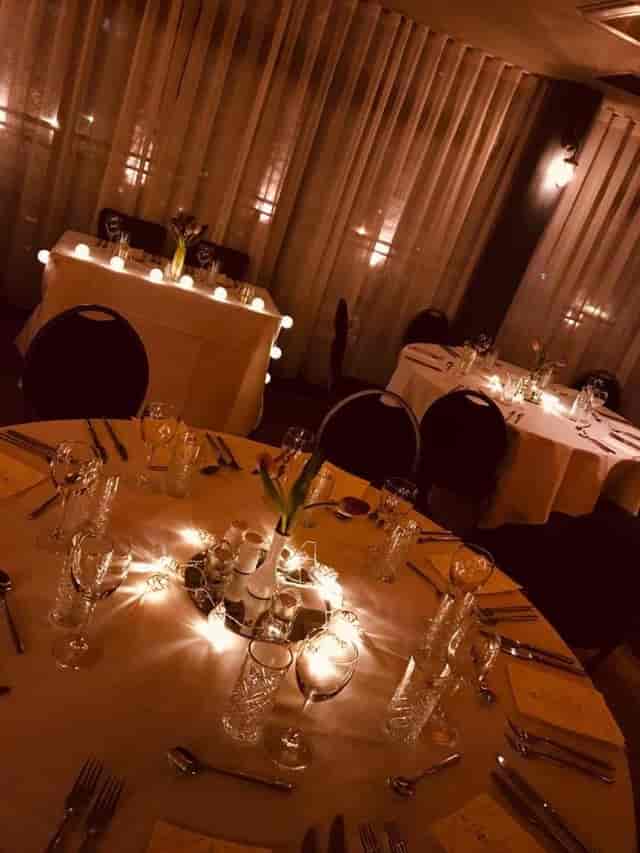 Elegant dining setup in Greenhouse Function Room for meetings and celebrations.