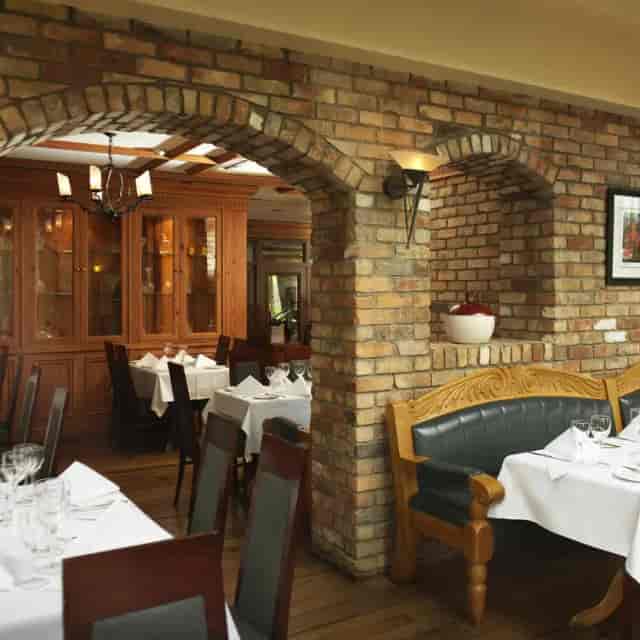 Charming restaurant at Red Cow Moran Hotel, cozy setting for intimate meetings and events.