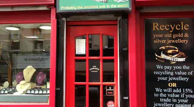 Charming red door of The Dawson Lounge, ideal for intimate gatherings and networking events.