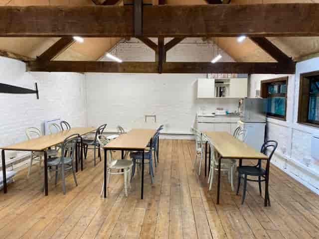 Hayloft at Horsenden Farm: rustic meeting space with natural light for workshops or events.