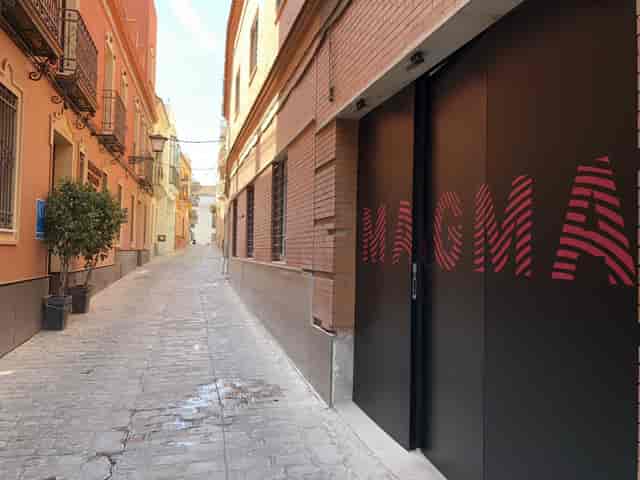 Stylish venue entrance at Bajeles, perfect for intimate corporate events in Sevilla.