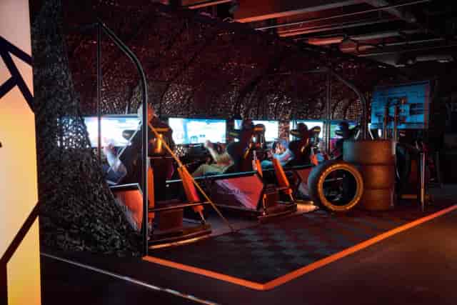 Gaming Zone at Hamburger Ding with sleek racing simulators for team-building events.