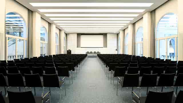 Modern conference hall, plenary sessions, corporate events.