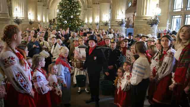 Hamburg Rathaus Christmas event, festive crowd, traditional attire
