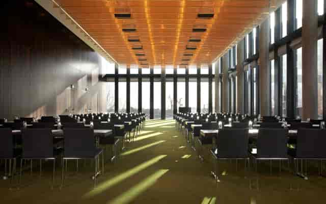 Empire Hotel conference room, natural light, corporate event, business meeting.