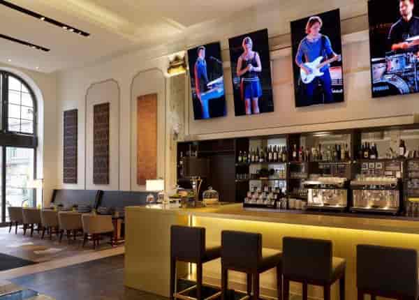 Reichshof Hotel Hamburg hall, digital music displays, live music event