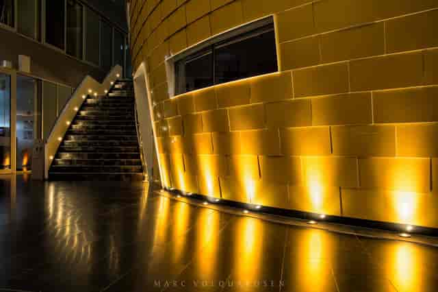Modern auditorium stage, uplighting, product launch, VIP event
