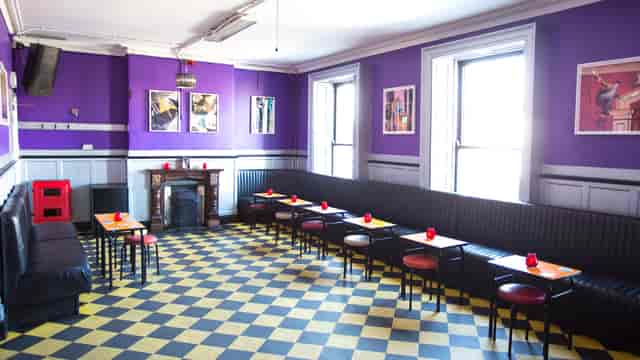 Workmans Club Main Room: Purple walls, checker floor, event venue
