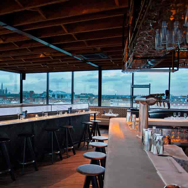 Rooftop bar with city views, ideal for upscale events and networking receptions.