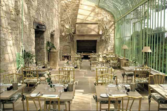 The Orangery at Cliff at Lyons: elegant glass features in a rustic restaurant for intimate events.