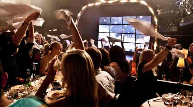 Wallmans Oslo event: engaged guests, focal screen, live entertainment