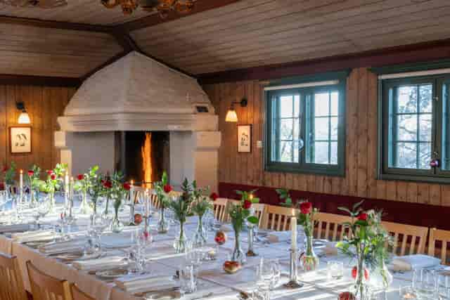 Rustic folk museum dining event, fireplace ambiance