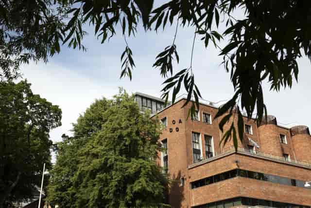 Modern Norway architecture event venue brick greenery