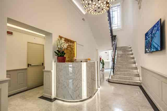 Modern boutique hotel lobby, marble desk, chandelier, wedding venue