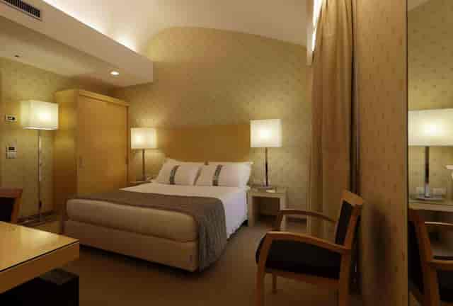 Milan hotel room king bed event attendee