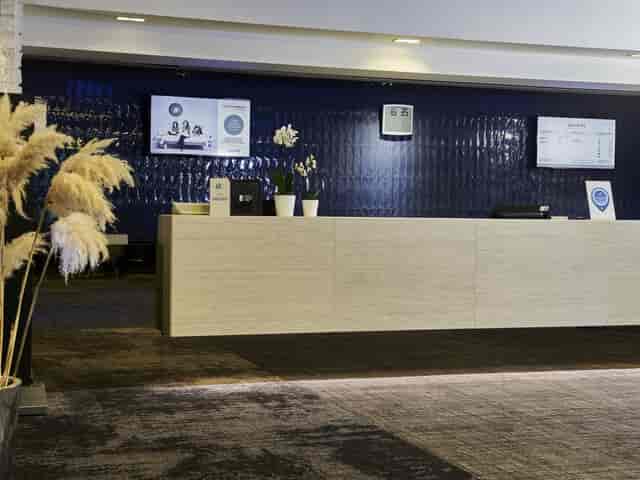 Novotel Milano Nord Ca Granda reception, modern desk, event signage