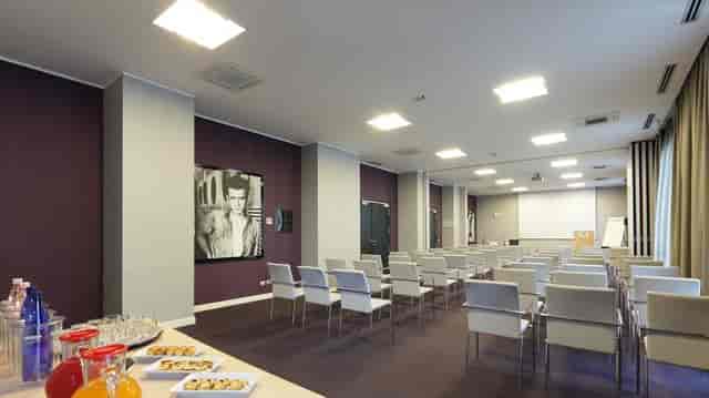 Milan conference, modern meeting room, theatre seating