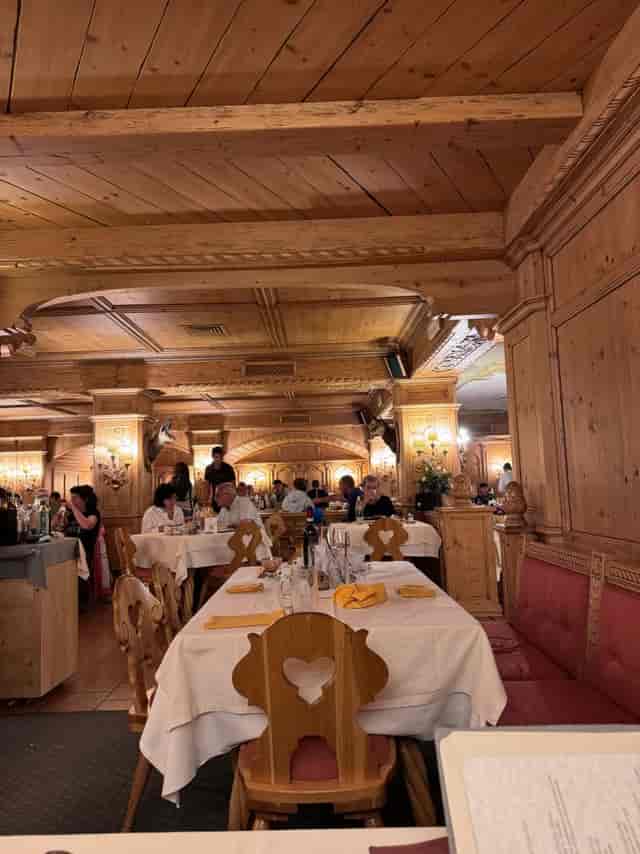 Rustic alpine restaurant, Valtellina Hotel, cozy event seating