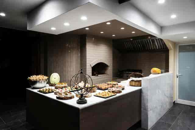 Rustic buffet setup, pizza oven, event catering, party food