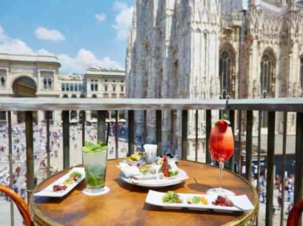 Elegant terrace event, city views, cocktail reception, networking