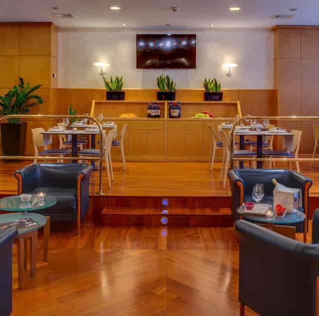 Italian restaurant reception, tiered seating, wood tones