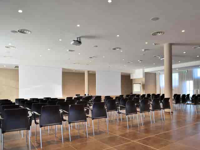 Milan hotel conference setup, screens, seating