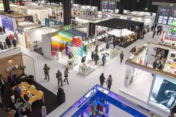 Allianz MiCo expo hall, vibrant booths, business networking event
