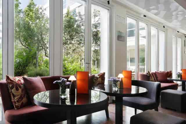 Lounge bar at Magna Pars Hotel, perfect for networking events with serene garden views.